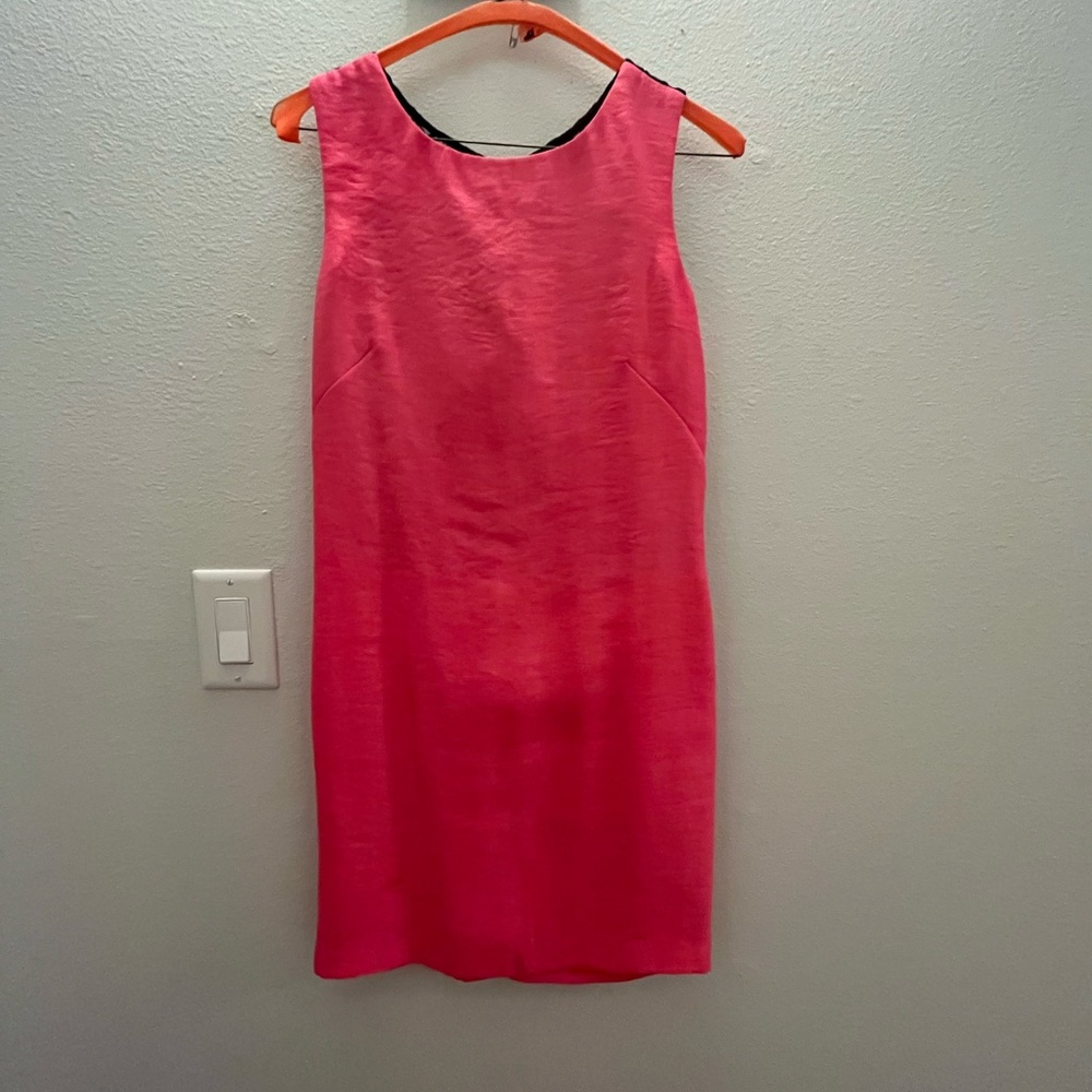 Hot pink sleeveless shift dress with black lace open back